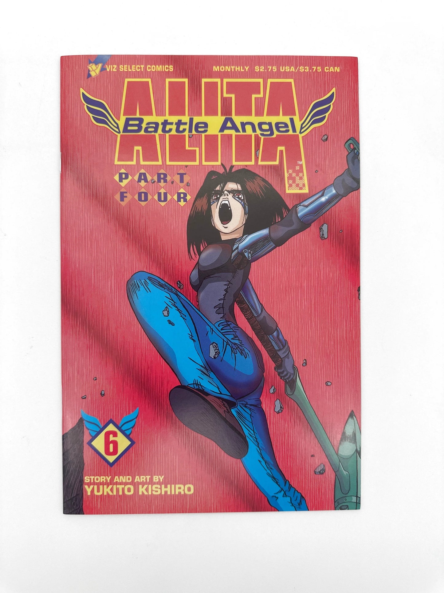 Alita Battle Angel comic book with a red cover featuring a female character in blue and black armor