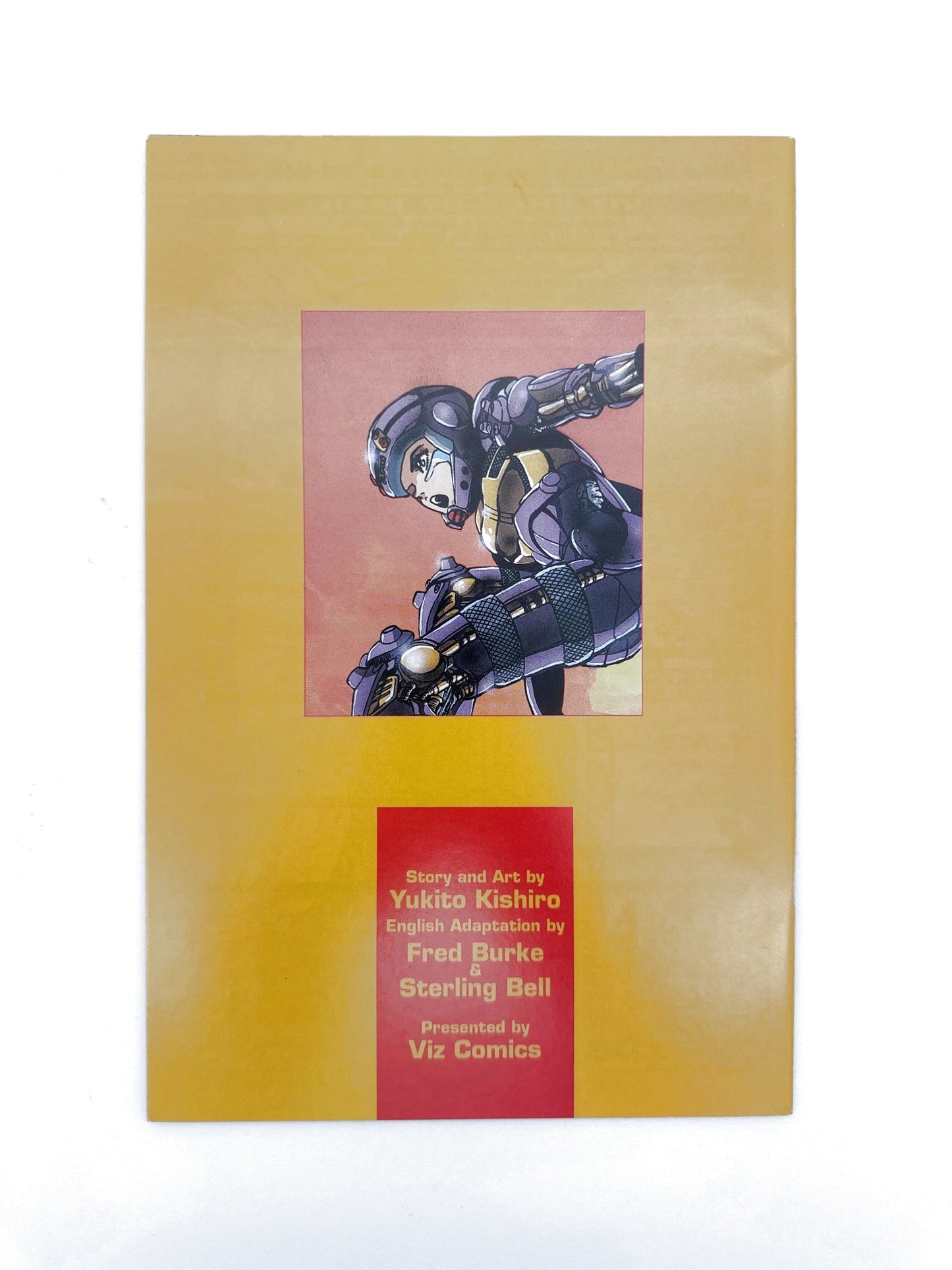 Manga comic book with a yellow cover and a central image of a character in futuristic armor.