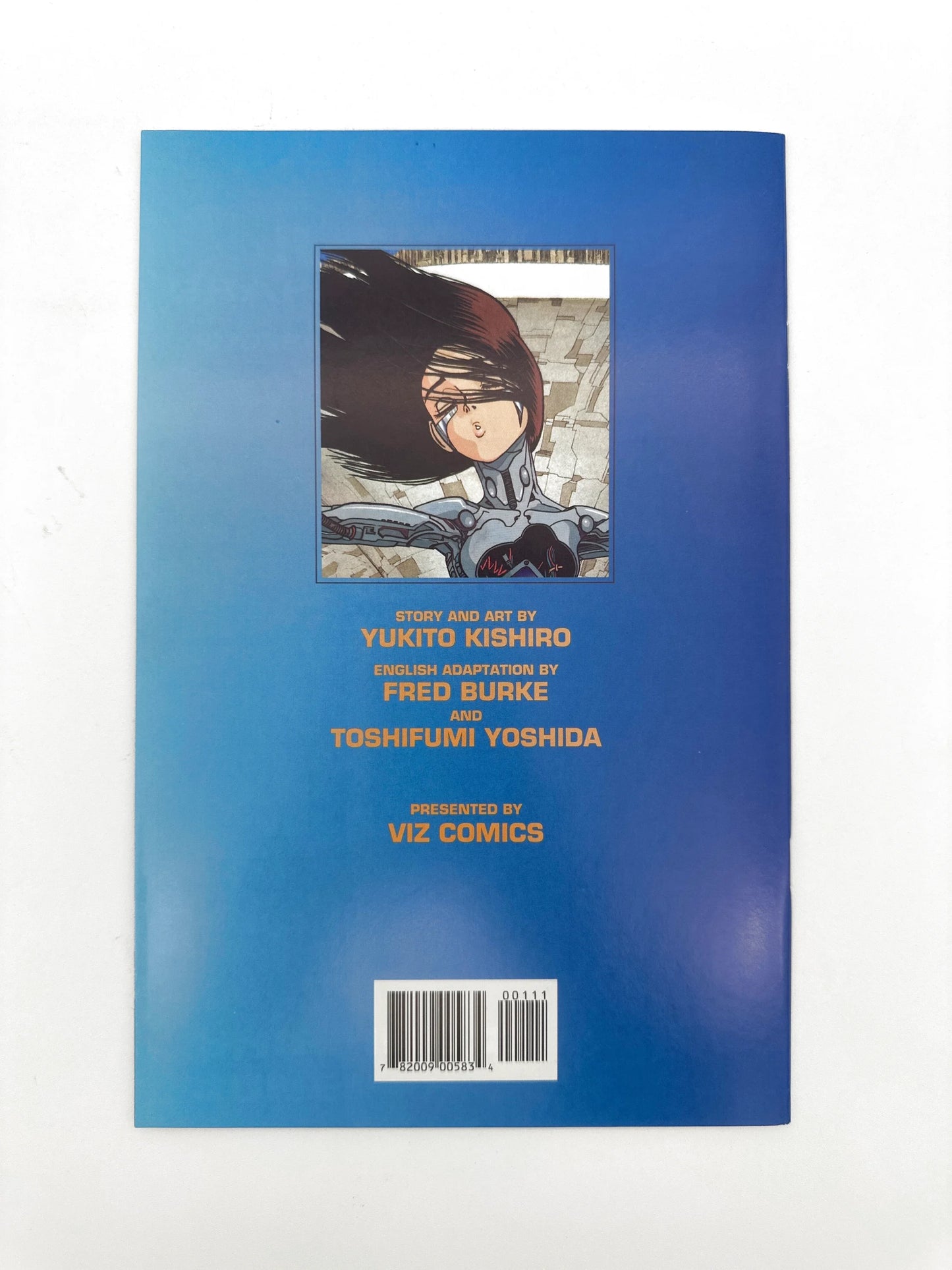 A manga comic book with a blue gradient cover featuring an anime character