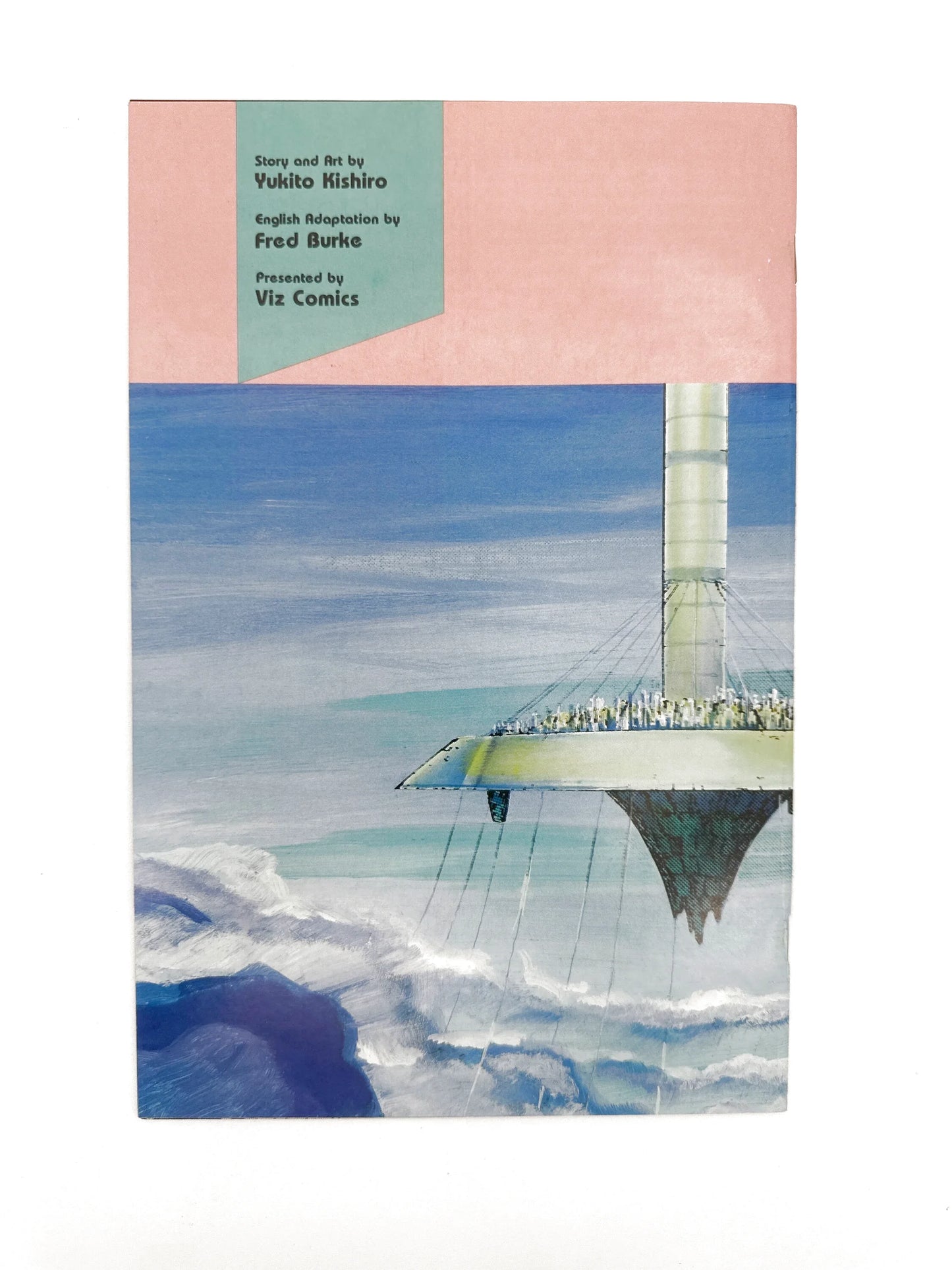 A manga volume with a futuristic floating city artwork.