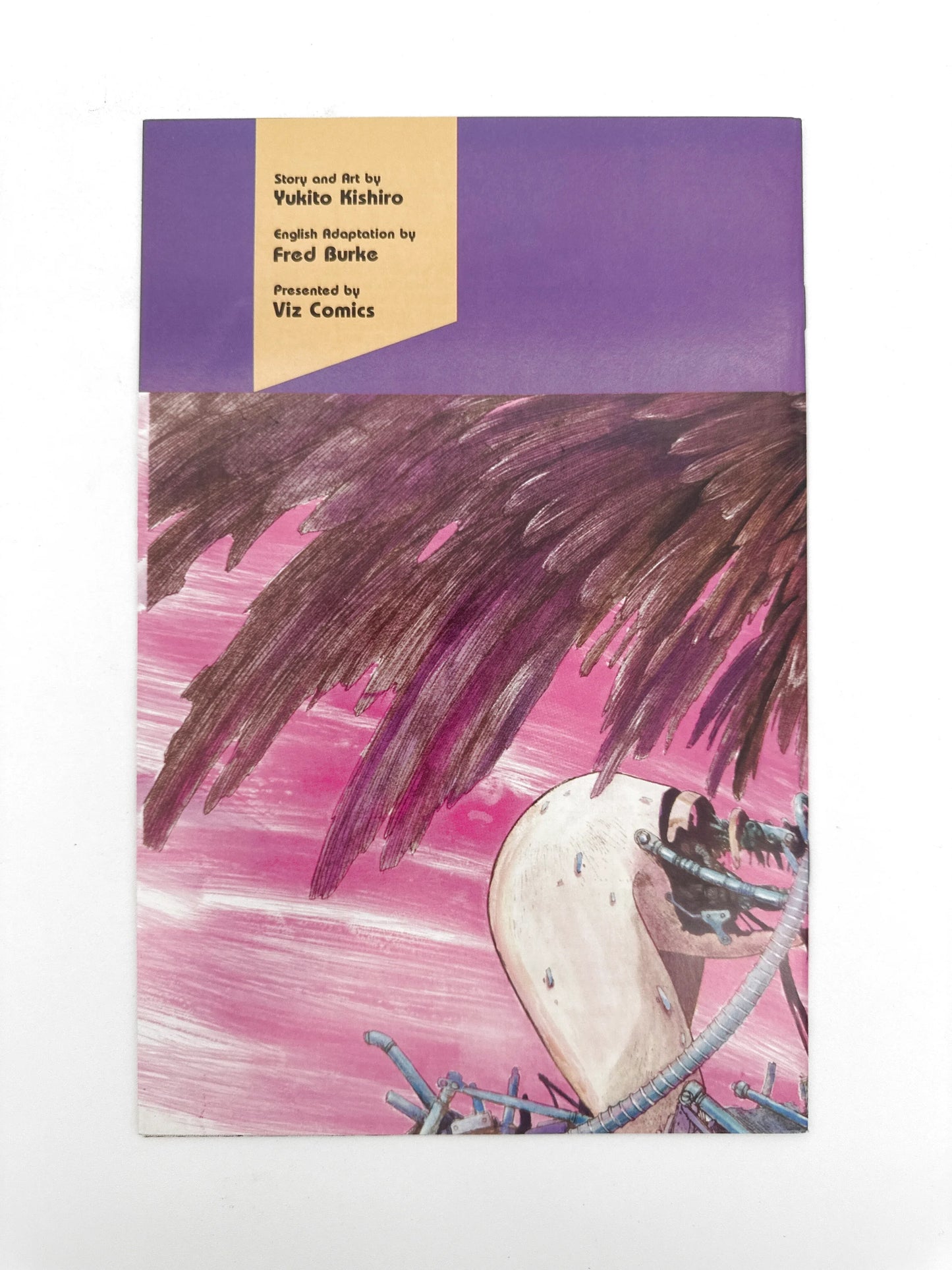 A manga comic book with a purple and yellow top, featuring artwork of a pink sky and dark, feathery forms