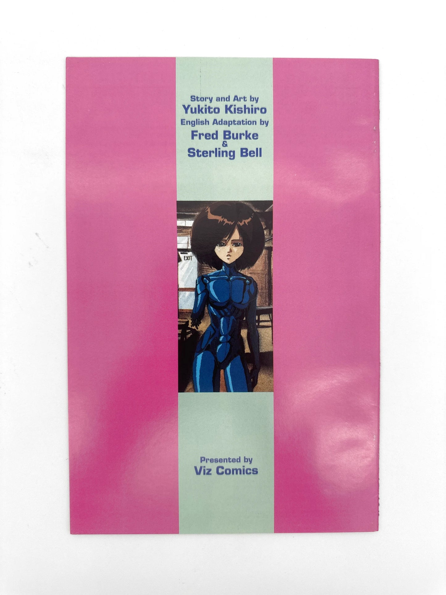 Pink-covered manga comic book with an anime character illustration.