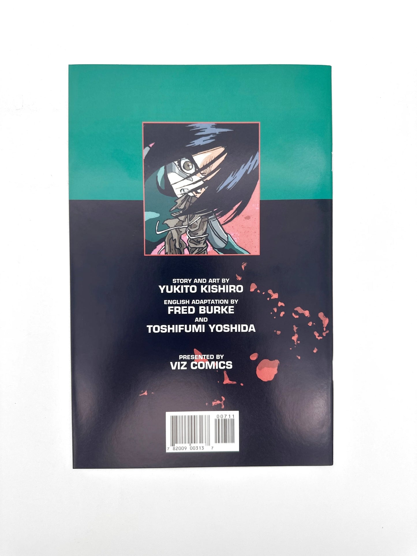 Manga comic book with a dark cover and an illustration of a character with black hair