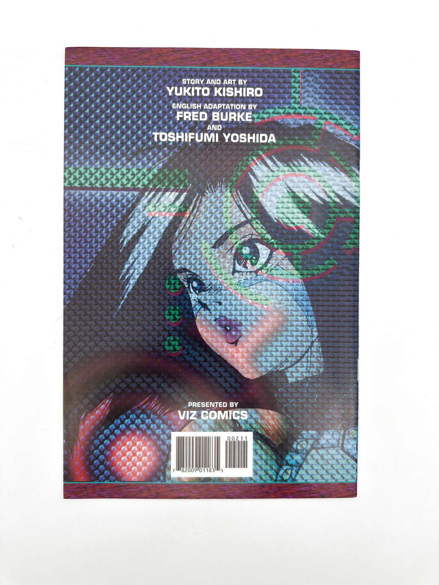 A comic book with a holographic cover featuring an anime character.