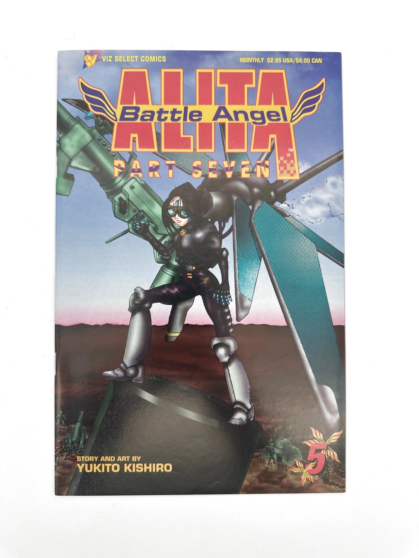 A comic book titled "Alita Battle Angel Part Seven" featuring a female character and a flying vehicle.
