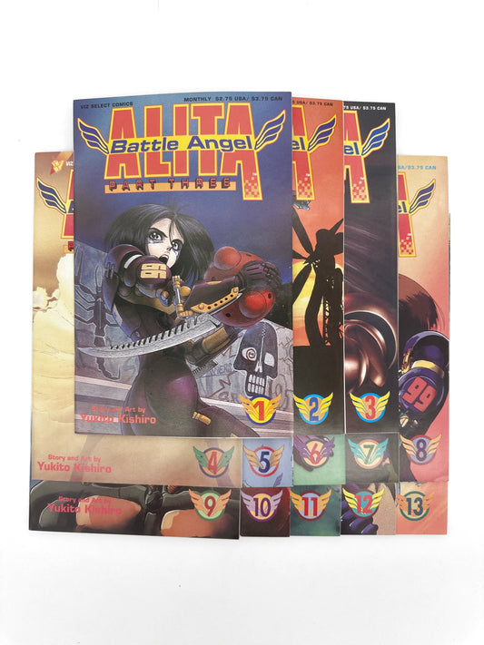A collection of thirteen "Alita Battle Angel" comic books, with the first volume prominently displayed.