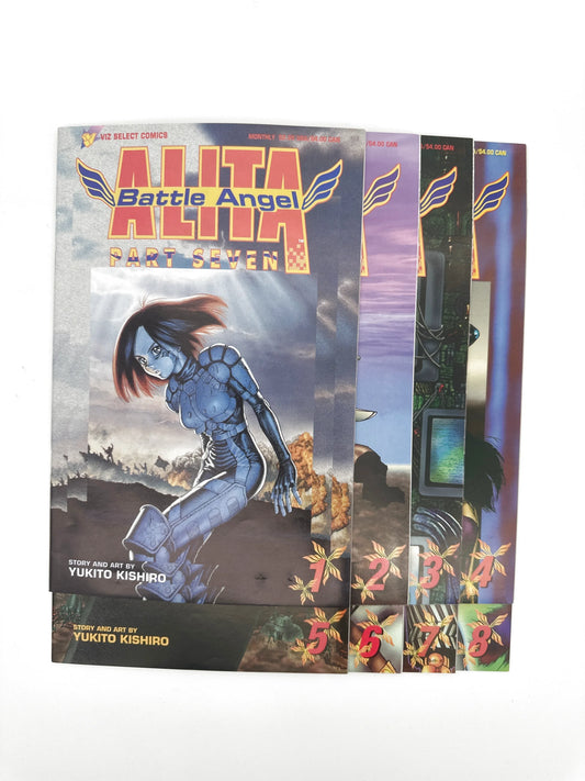 A stack of four "Battle Angel Alita" comic books.