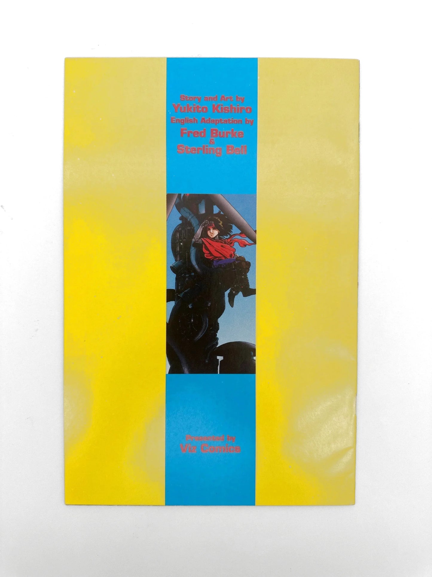 Yellow and blue book with an anime-style illustration.