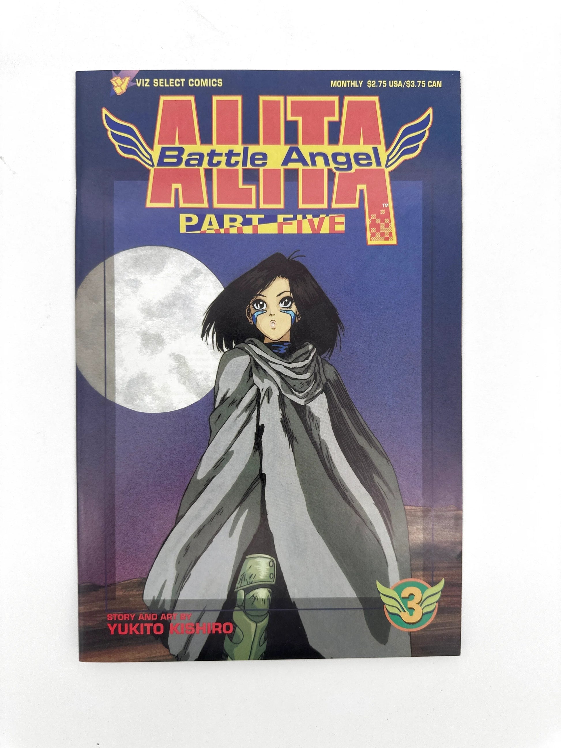A comic book with a dark blue cover featuring a female character in a grey cloak, a large white moon, and the title ’ALITA Battle Angel PART FIVE’