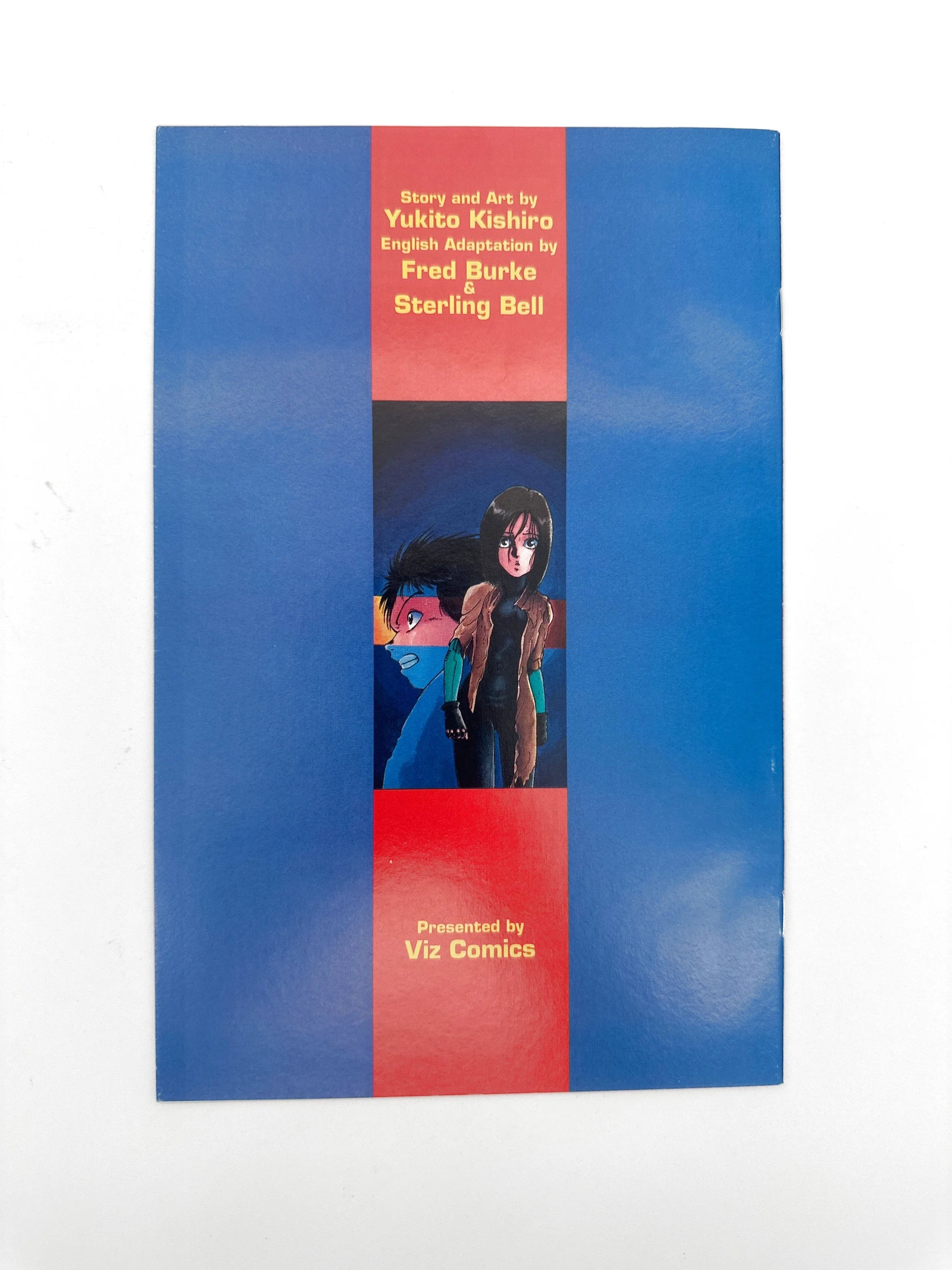 A manga comic book with a blue and red cover featuring two anime characters.