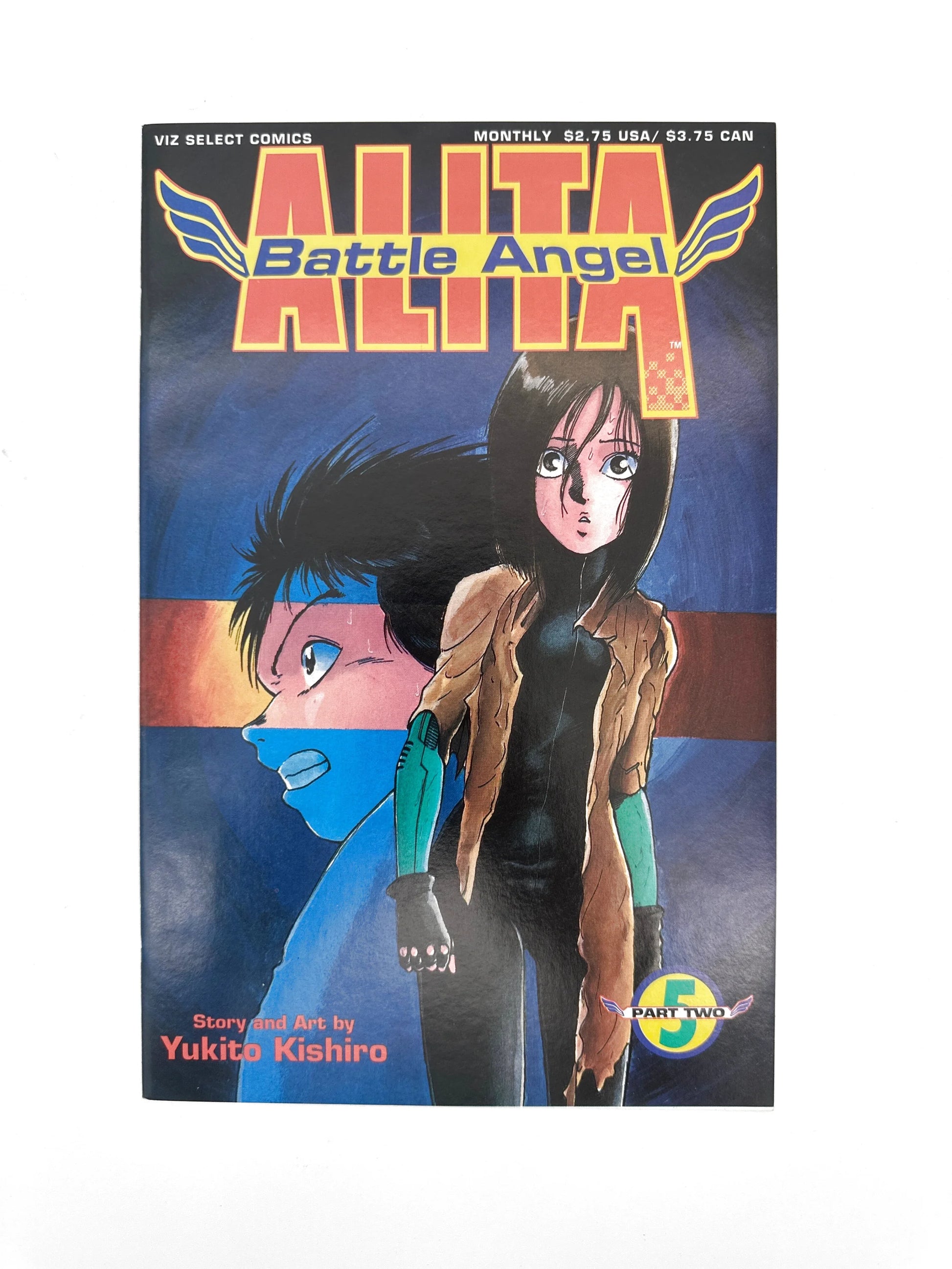 A manga comic book with a dark-haired, big-eyed female character on the cover.